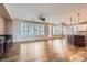 Spacious living room with hardwood floors and large windows offering ample natural light at 4311 Fiore Bella Blvd, Las Vegas, NV 89135