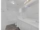 Clean bathroom with a shower-tub combo, double vanity, and vinyl flooring at 4807 Leadership Ct, North Las Vegas, NV 89031