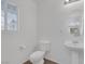 Clean, well-lit bathroom with standard white fixtures and tile flooring at 4807 Leadership Ct, North Las Vegas, NV 89031