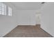 Neutral carpeted bedroom with white walls and ceilings offers a minimalist and clean aesthetic at 4807 Leadership Ct, North Las Vegas, NV 89031