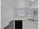 Bright kitchen view featuring white cabinets, quartz countertops, stainless steel sink, and modern lighting at 4807 Leadership Ct, North Las Vegas, NV 89031