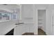 Well lit kitchen featuring a pantry, open floor plan, and stainless steel sink at 4807 Leadership Ct, North Las Vegas, NV 89031