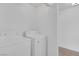 Laundry area with a white washer and dryer at 4807 Leadership Ct, North Las Vegas, NV 89031