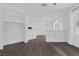 Open concept living room featuring hardwood floors and custom shelving at 4807 Leadership Ct, North Las Vegas, NV 89031