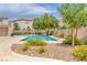 Community pool surrounded by beautiful flowers and greenery at 4807 Leadership Ct, North Las Vegas, NV 89031