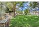 Community green space with mature trees and benches, perfect for relaxing outdoors at 4998 Schumann Dr, Las Vegas, NV 89146