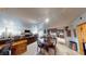 Open-concept living room featuring a fireplace, tile floors, and seamless kitchen access at 4998 Schumann Dr, Las Vegas, NV 89146