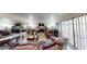 Spacious living room boasting a stone fireplace, large mirror, and comfortable seating area at 4998 Schumann Dr, Las Vegas, NV 89146