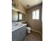 Bathroom featuring a single sink vanity with a large mirror at 5128 Sandstone Dr, Las Vegas, NV 89142