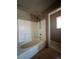 Bright bathroom featuring a shower and tub combo with white tile and modern fixtures at 5128 Sandstone Dr, Las Vegas, NV 89142