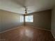 This inviting bedroom features hardwood floors and two windows for great natural light at 5128 Sandstone Dr, Las Vegas, NV 89142
