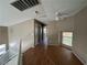 Bright hallway with hardwood floors, neutral paint, and a ceiling fan; perfect for a welcoming entryway at 5128 Sandstone Dr, Las Vegas, NV 89142
