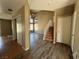 Spacious living room featuring wood flooring and a staircase at 5128 Sandstone Dr, Las Vegas, NV 89142