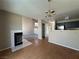 Open floor plan with fireplace and view into the kitchen at 5128 Sandstone Dr, Las Vegas, NV 89142