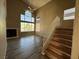 Bright living room with a fireplace and large windows overlooking palm trees at 5128 Sandstone Dr, Las Vegas, NV 89142
