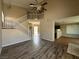 Spacious living room featuring wood flooring and a staircase at 5128 Sandstone Dr, Las Vegas, NV 89142