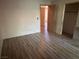 Neutral bedroom with wood-look floors and closet at 5199 Caliente St # 64, Las Vegas, NV 89119