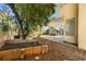 Backyard with covered patio area and a small garden space at 5332 Desert Blossom Rd, Las Vegas, NV 89107
