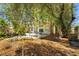 Backyard with tree, partial patio, garden area, and partial rock landscaping at 5332 Desert Blossom Rd, Las Vegas, NV 89107