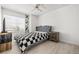 Bedroom featuring light wood floors, a ceiling fan, and a decorative black and white bedspread at 5332 Desert Blossom Rd, Las Vegas, NV 89107