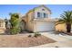 Charming two-story home featuring a well-maintained stucco exterior and a two-car garage at 5332 Desert Blossom Rd, Las Vegas, NV 89107