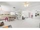 Modern kitchen with sleek cabinets, marble countertops, and a convenient breakfast bar at 5332 Desert Blossom Rd, Las Vegas, NV 89107
