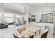 Bright open concept living area with marble floors and easy access to the dining and kitchen areas at 5332 Desert Blossom Rd, Las Vegas, NV 89107