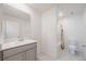 Modern bathroom featuring quartz countertop and a shower-tub combo at 5927 Coja St, Las Vegas, NV 89113