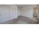 Bright, carpeted bedroom with a spacious closet and view into the en-suite bathroom at 5927 Coja St, Las Vegas, NV 89113
