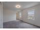 Bright bedroom offering modern lighting, a large window, and plush carpeting at 5927 Coja St, Las Vegas, NV 89113