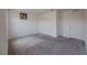 A bright, carpeted bedroom features a spacious closet and a simple decor at 5927 Coja St, Las Vegas, NV 89113