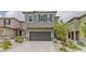 Charming two-story home boasts a neutral color, two-car garage, and low-maintenance landscaping at 5927 Coja St, Las Vegas, NV 89113