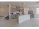 Open kitchen with stainless steel appliances, modern cabinets, and an island, perfect for entertaining at 5927 Coja St, Las Vegas, NV 89113