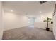 A bright living room features neutral carpet and a decorative houseplant at 5927 Coja St, Las Vegas, NV 89113