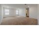 A large living room is bright with natural light from two windows at 5927 Coja St, Las Vegas, NV 89113