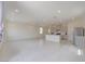 Open-concept living space with tile flooring, recessed lighting, and a kitchen with stainless steel appliances at 5927 Coja St, Las Vegas, NV 89113