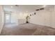 Spacious living room features neutral carpet and leads to an open doorway at 5927 Coja St, Las Vegas, NV 89113
