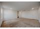 A spacious living room features carpet, white walls and recessed lighting at 5927 Coja St, Las Vegas, NV 89113