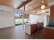 Open-concept kitchen featuring granite countertops, and an outdoor pool view at 6112 Fairwood Cir, Las Vegas, NV 89107