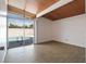 Living room with wood tile flooring, large sliding glass doors to the pool at 6112 Fairwood Cir, Las Vegas, NV 89107