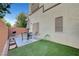Private backyard with artificial grass, patio space, and a barbecue grill at 6170 E Sahara Ave # 1061, Las Vegas, NV 89142