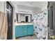 Charming bathroom with a double sink vanity, framed mirror, and a shower with a butterfly curtain at 6170 E Sahara Ave # 1061, Las Vegas, NV 89142