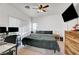 Cozy bedroom with a ceiling fan, large window, and carpet flooring at 6170 E Sahara Ave # 1061, Las Vegas, NV 89142