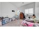 Comfortable bedroom with carpet, a window, and a changing table at 6170 E Sahara Ave # 1061, Las Vegas, NV 89142
