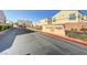Exterior view of the Granite Crest community sign with the street and some nearby homes at 6170 E Sahara Ave # 1061, Las Vegas, NV 89142