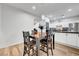 Bright dining area features modern lighting, hardwood floors, and opens to the kitchen at 6170 E Sahara Ave # 1061, Las Vegas, NV 89142