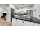 Bright modern kitchen featuring granite countertops, stainless steel appliances, and white cabinetry at 6170 E Sahara Ave # 1061, Las Vegas, NV 89142