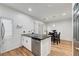 Open-concept kitchen with stainless steel appliances, island sink, and adjacent dining area at 6170 E Sahara Ave # 1061, Las Vegas, NV 89142