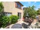 Backyard featuring a patio, a well-maintained lawn, mature trees, and outdoor seating area at 632 Monument Point St, Henderson, NV 89002