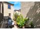 Cozy backyard with shaded seating and colorful flower beds at 632 Monument Point St, Henderson, NV 89002